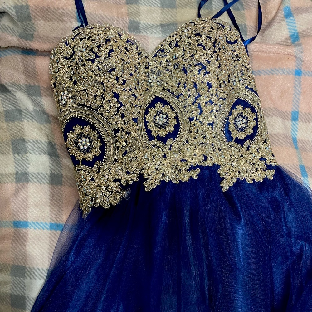 This dress is good for any formal occasion it is a size medium/ small worn once